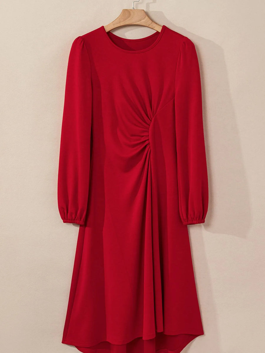 Red dress with long sleeves on a beige background