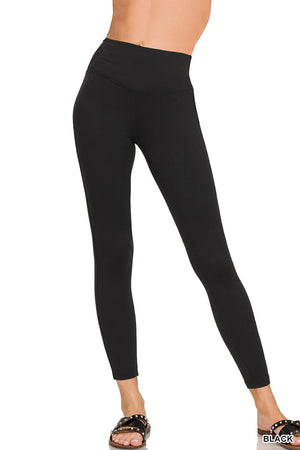 Black leggings worn by a person on a white background