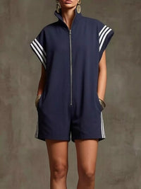 Navy blue sleeveless romper with white stripes on a plain background