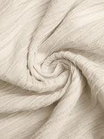 Close-up of beige fabric with a textured pattern