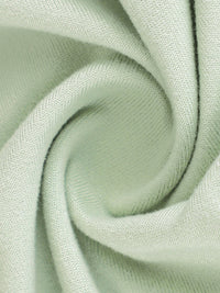 Close-up of light green fabric with a subtle texture