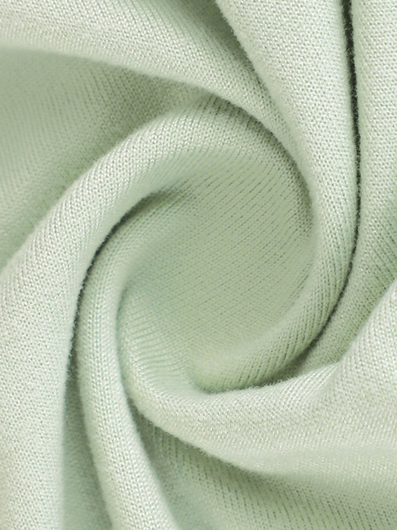 Close-up of light green fabric with a subtle texture