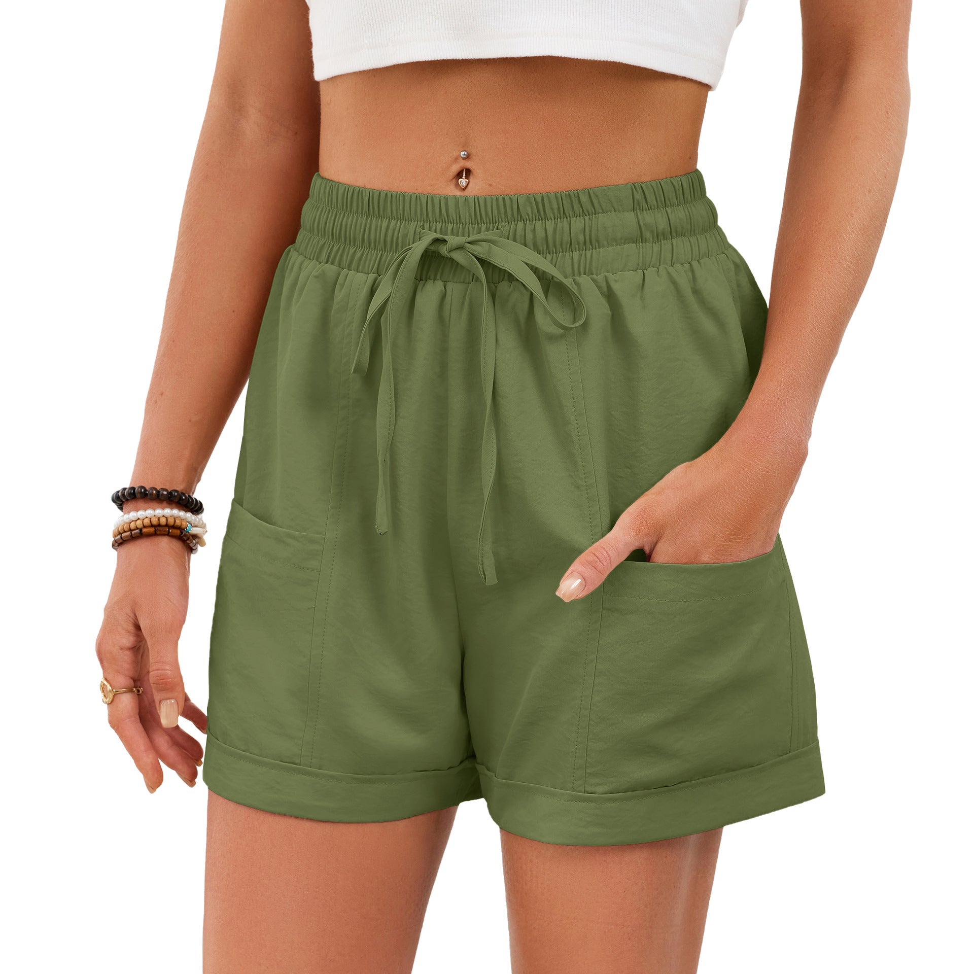 Green shorts worn by a person on a white background