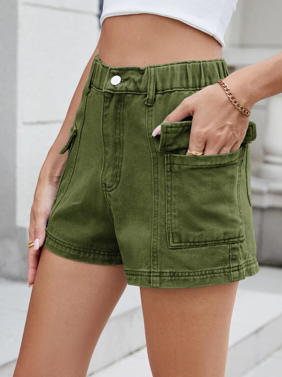 Person wearing green shorts with a blurred background
