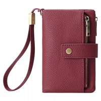 Maroon leather wallet with wrist strap and zipper on a white background