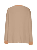 Beige sweater with brown cuffs and hem on a white background