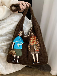 Brown textured bag with embroidered figures of a man and a woman holding hands.