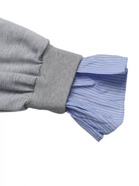 Gray sleeve with pleated blue cuffs on a white background