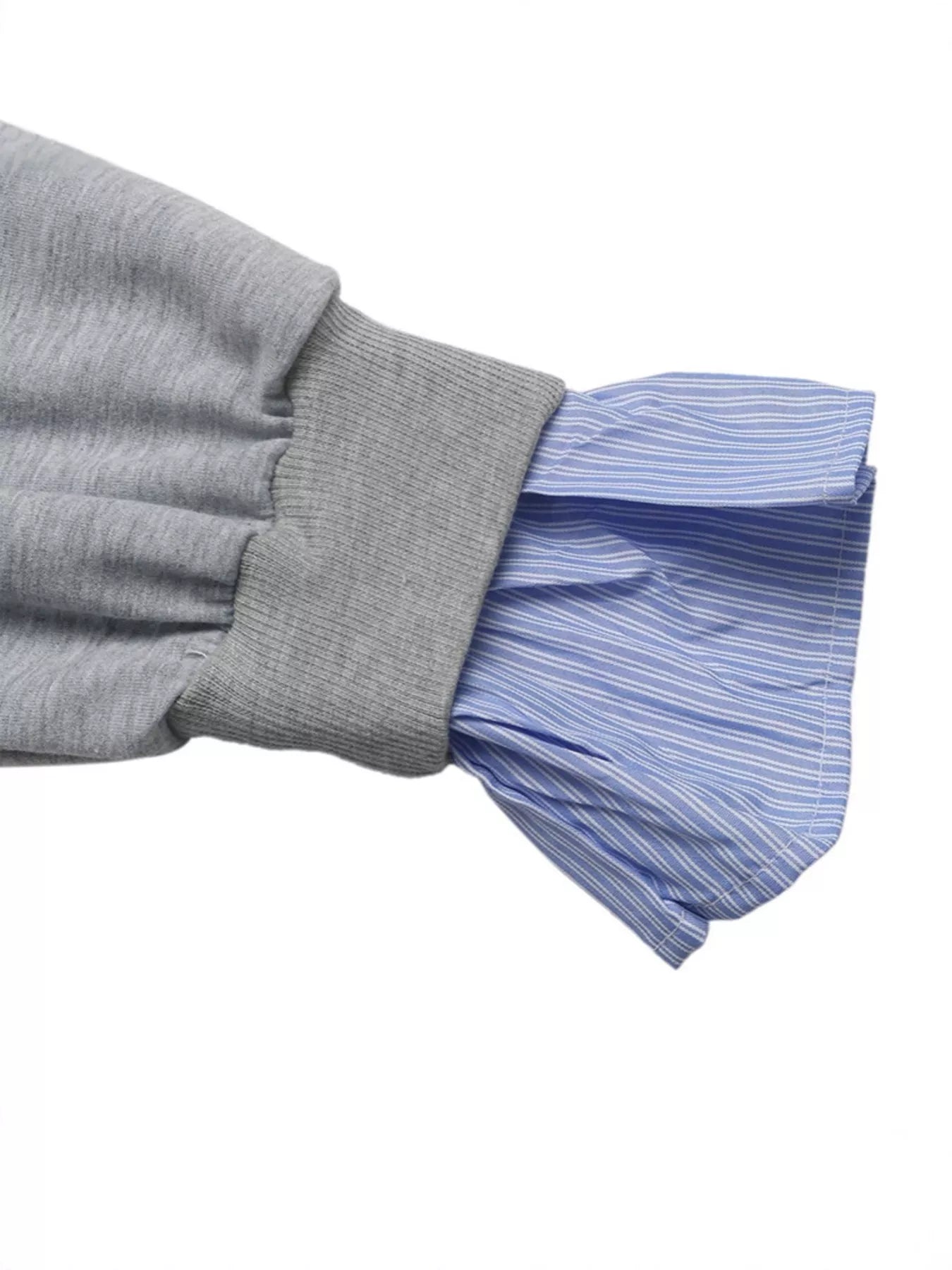 Gray sleeve with pleated blue cuffs on a white background