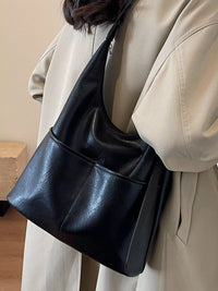 Woman carrying the black Adjustable Strap Shoulder Bag For Women