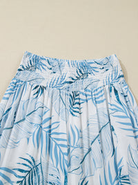 Blue and white leaf-patterned skirt on a beige background