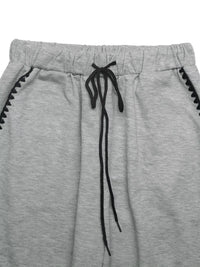 Gray sweatpants with black drawstring and trim on a white background