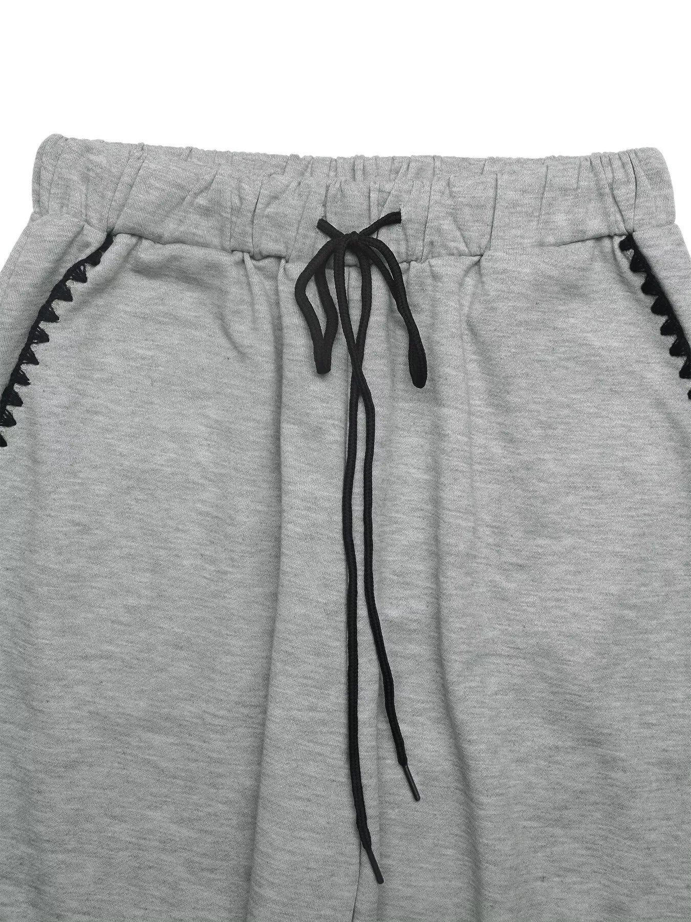 Gray sweatpants with black drawstring and trim on a white background