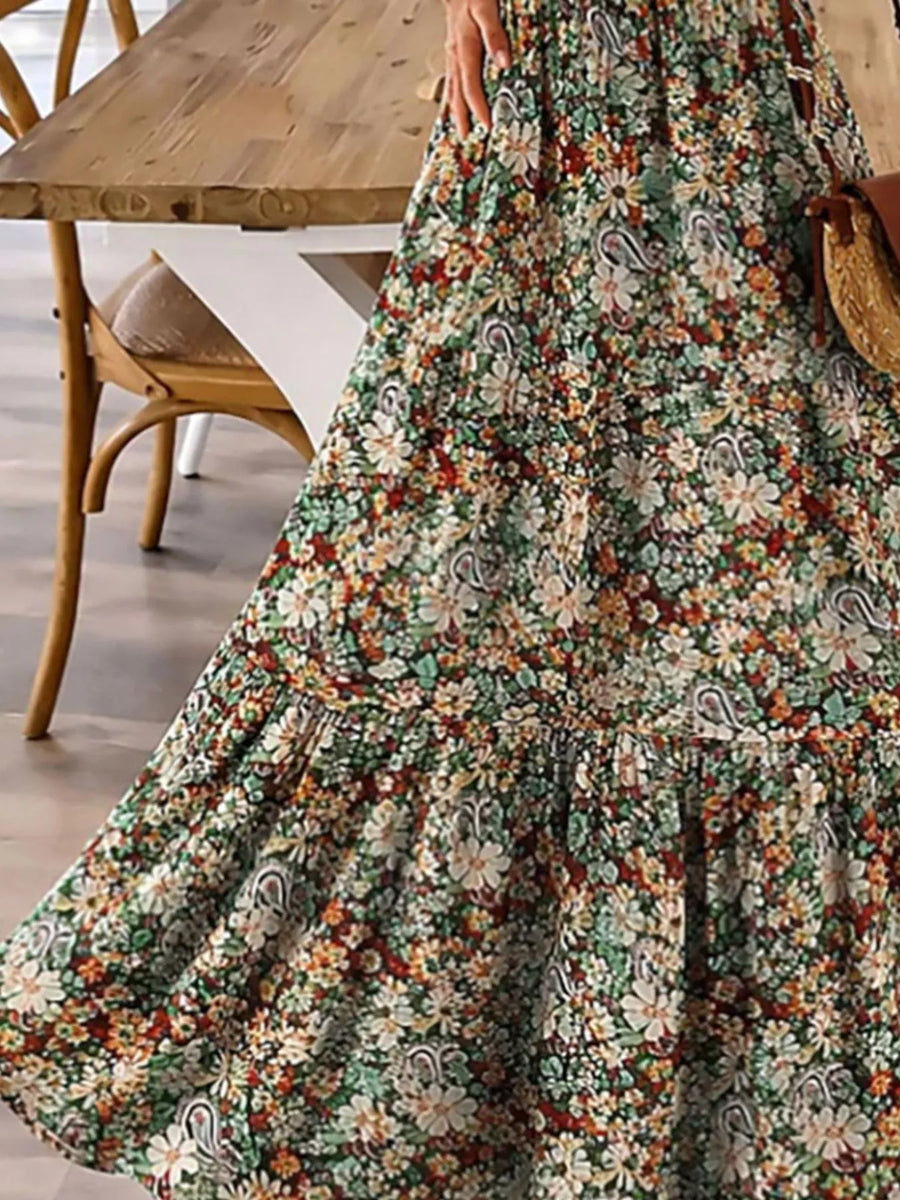 Floral dress with a wooden table and chair in the background