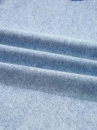 Close-up of blue denim fabric with visible texture