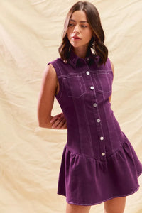 Woman wearing a purple dress with a beige background