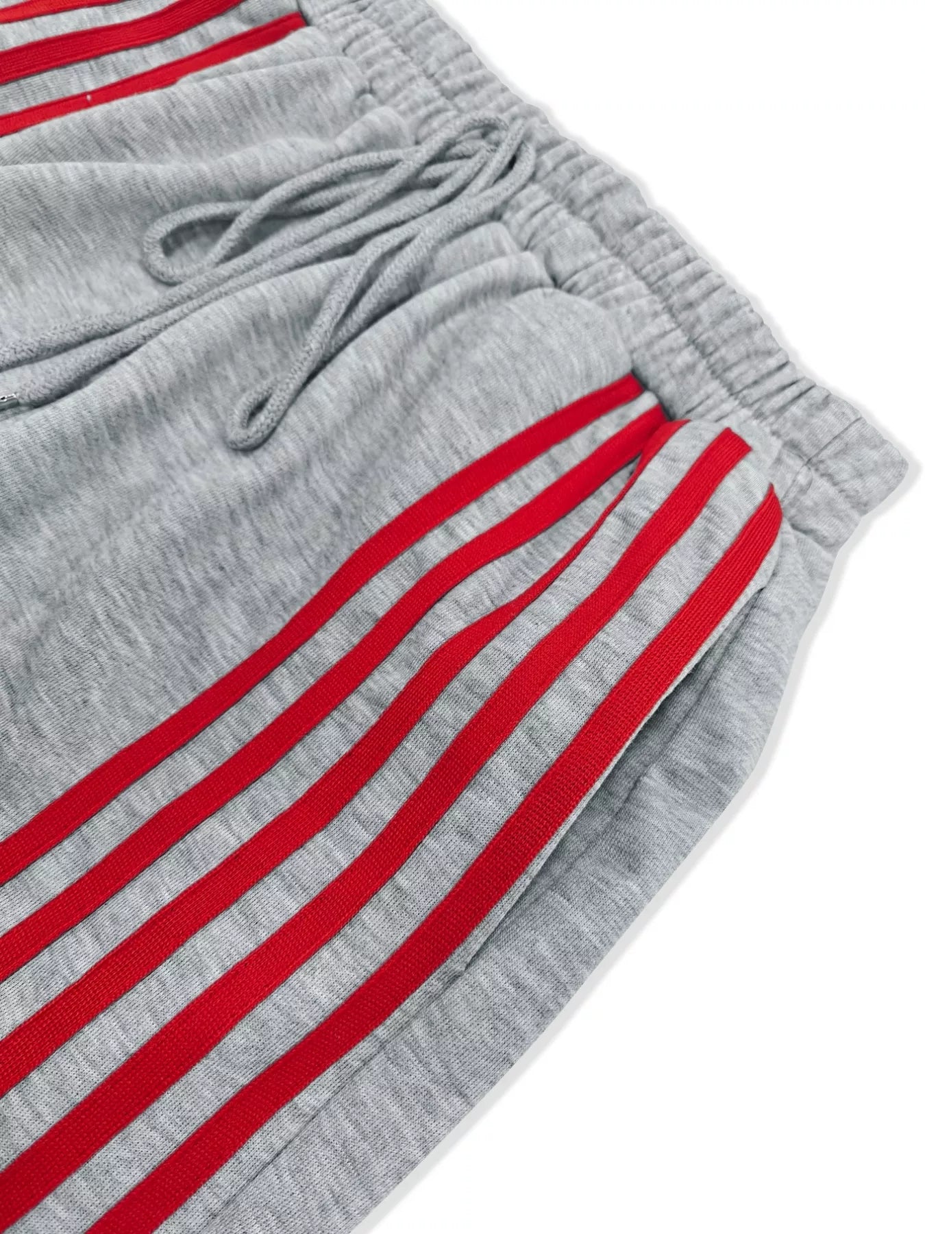 Gray shorts with red stripes on a white background