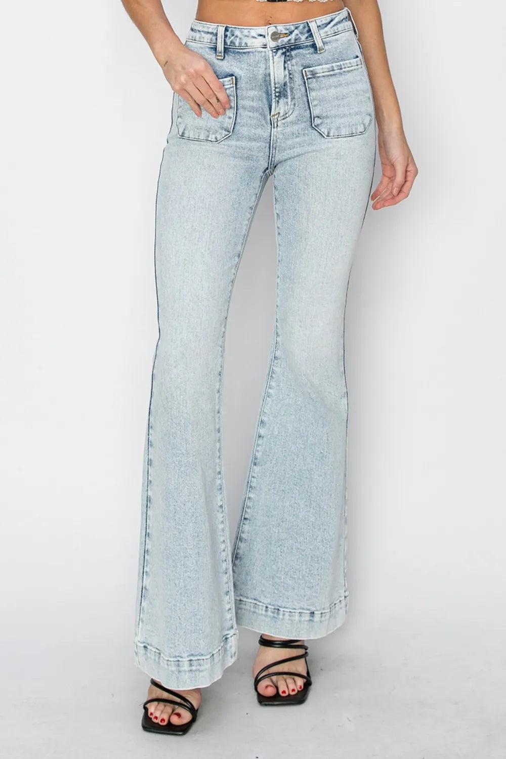 Light blue jeans worn by a person on a white background