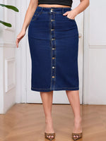 Person wearing a blue denim skirt with button details on a wooden floor.