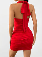 Red halter neck dress with a tie detail on a white background