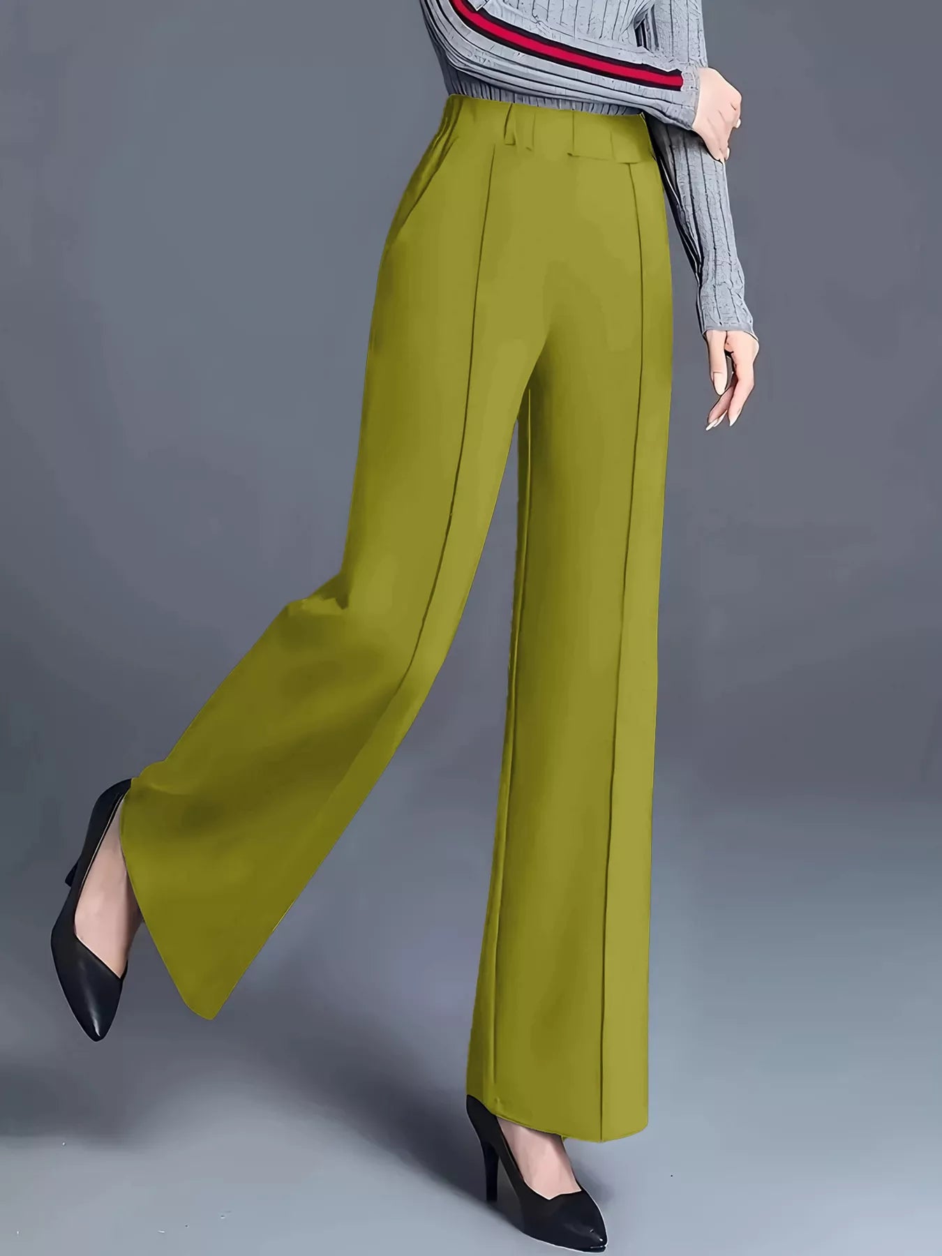 Green wide-leg pants worn by a person on a gray background