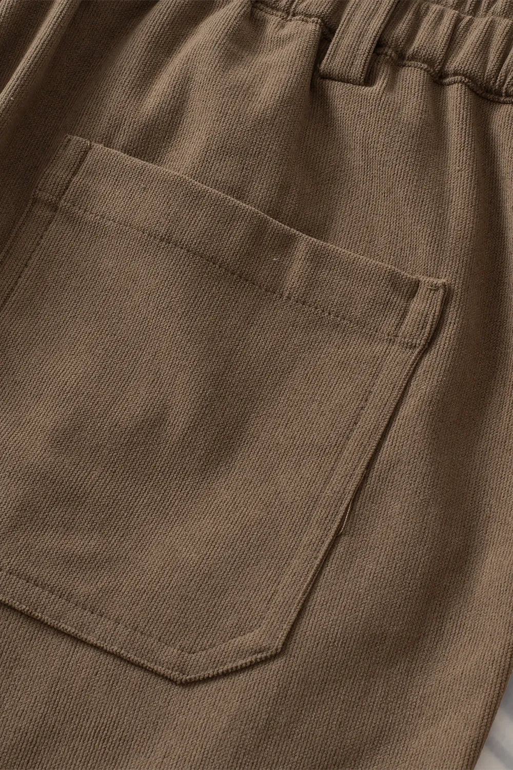 Close-up of brown pants with a pocket