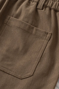 Close-up of brown pants with a pocket