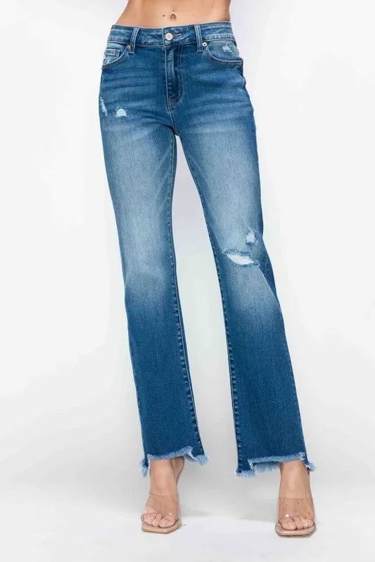 Blue jeans with a distressed look on a white background