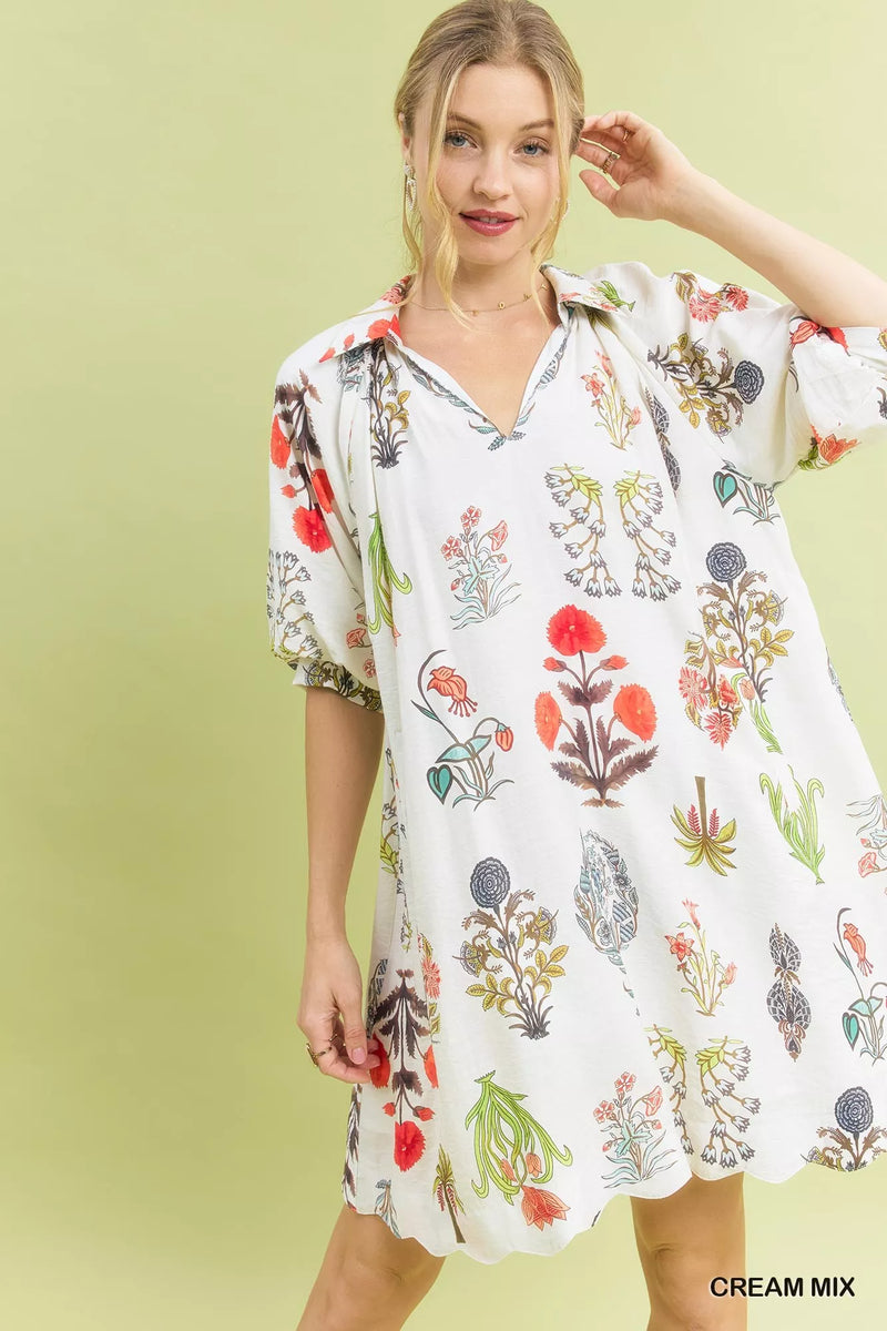 Woman wearing a floral dress against a light green background