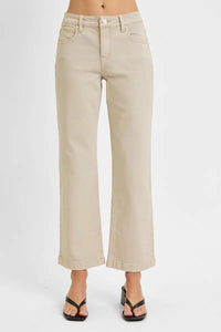 Beige wide-leg pants worn by a person on a white background