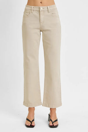 Beige wide-leg pants worn by a person on a white background