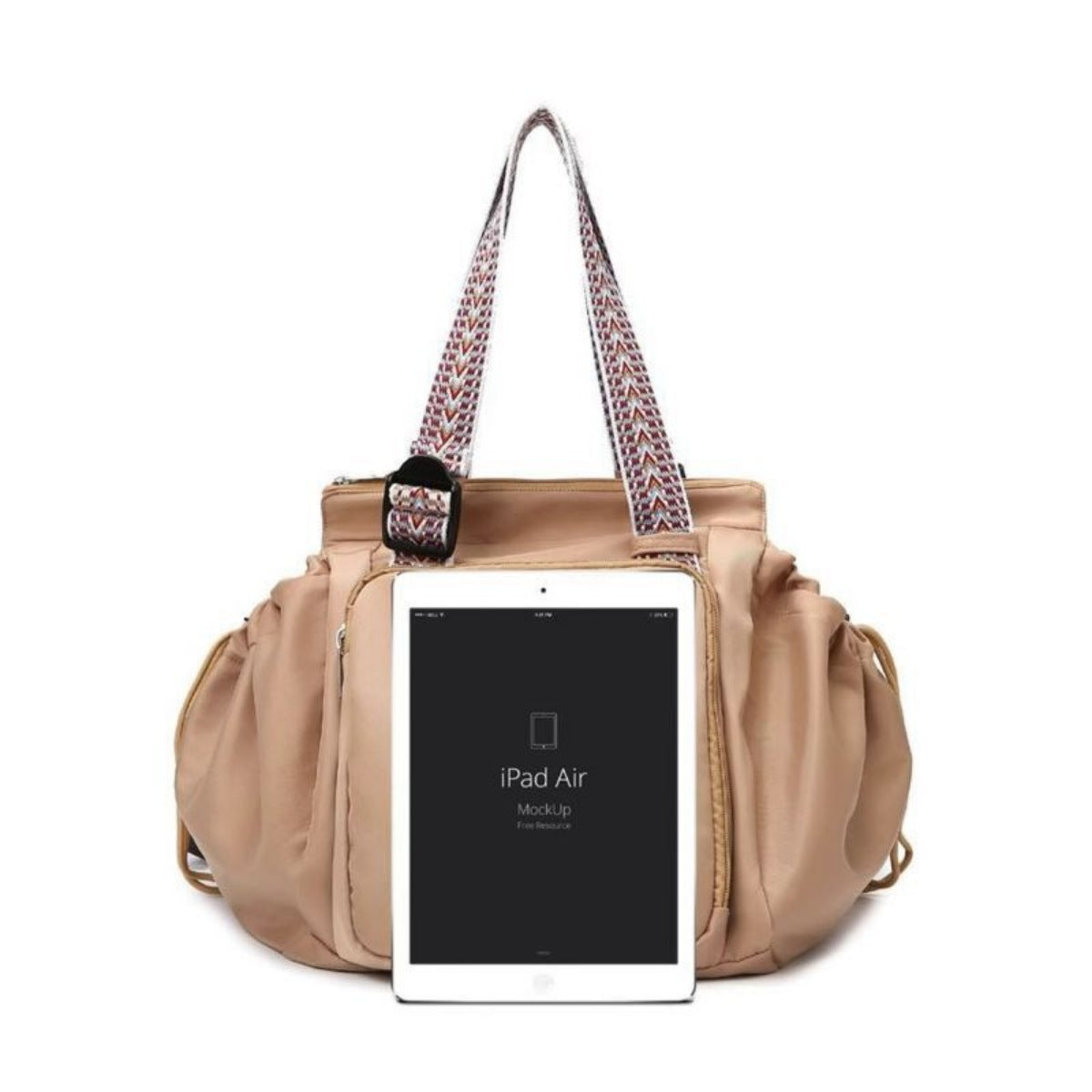 Beige handbag with a patterned strap holding an iPad Air on a white background