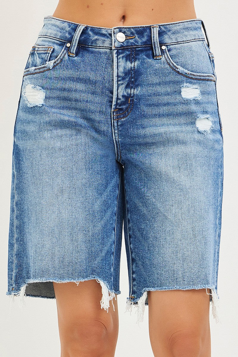 Blue denim shorts with slight distressing on a white background