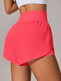 Person wearing a bright pink skirt on a plain background