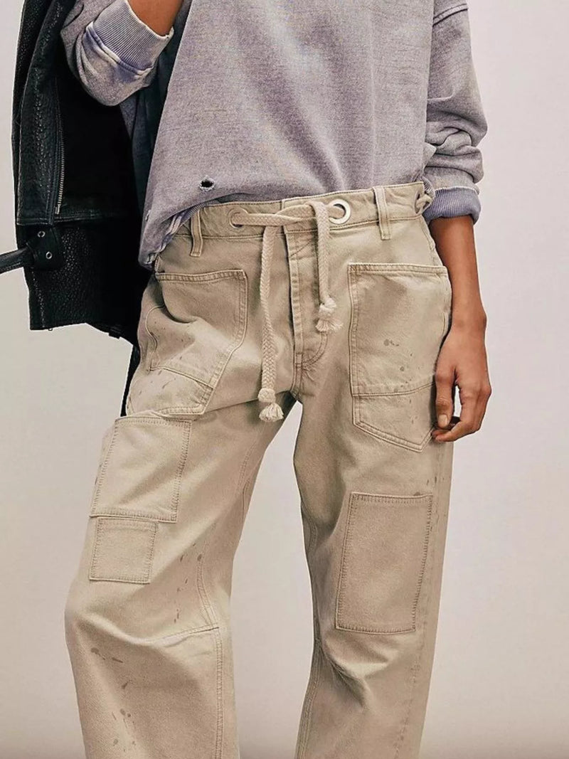 Close up view of beige jeans