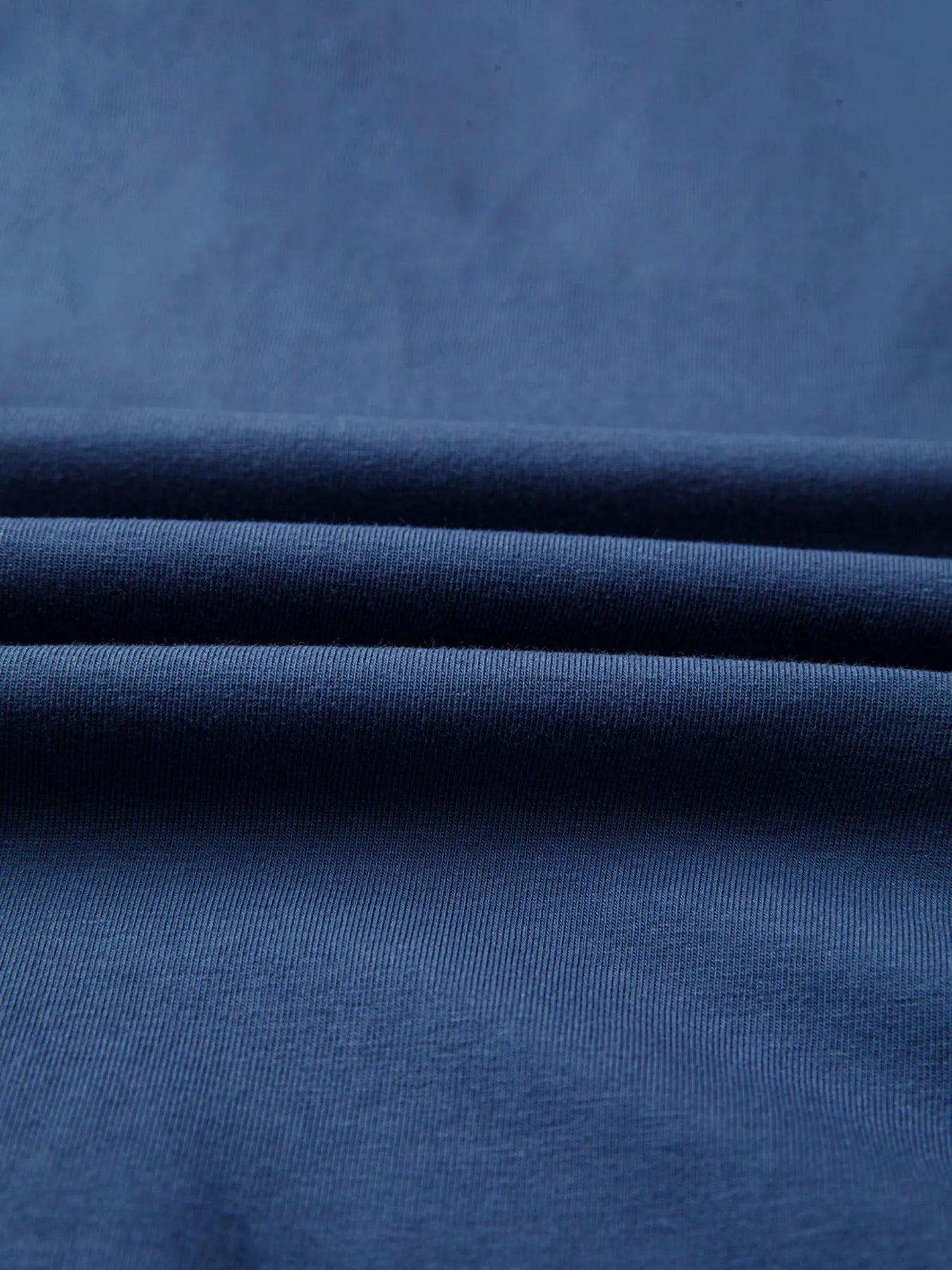 Close-up of blue fabric with folds