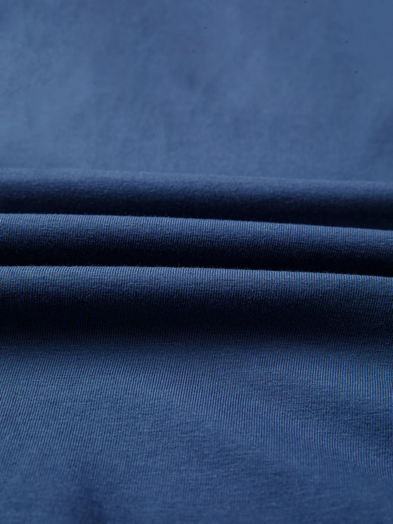 Close-up of blue fabric with folds
