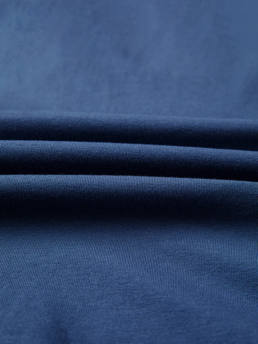 Close-up of blue fabric with folds