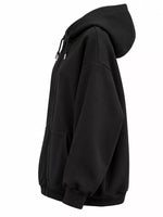 A black zip-up hoodie shown from a side profile view against a plain white background.