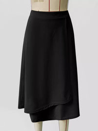 Black skirt on a mannequin against a white background