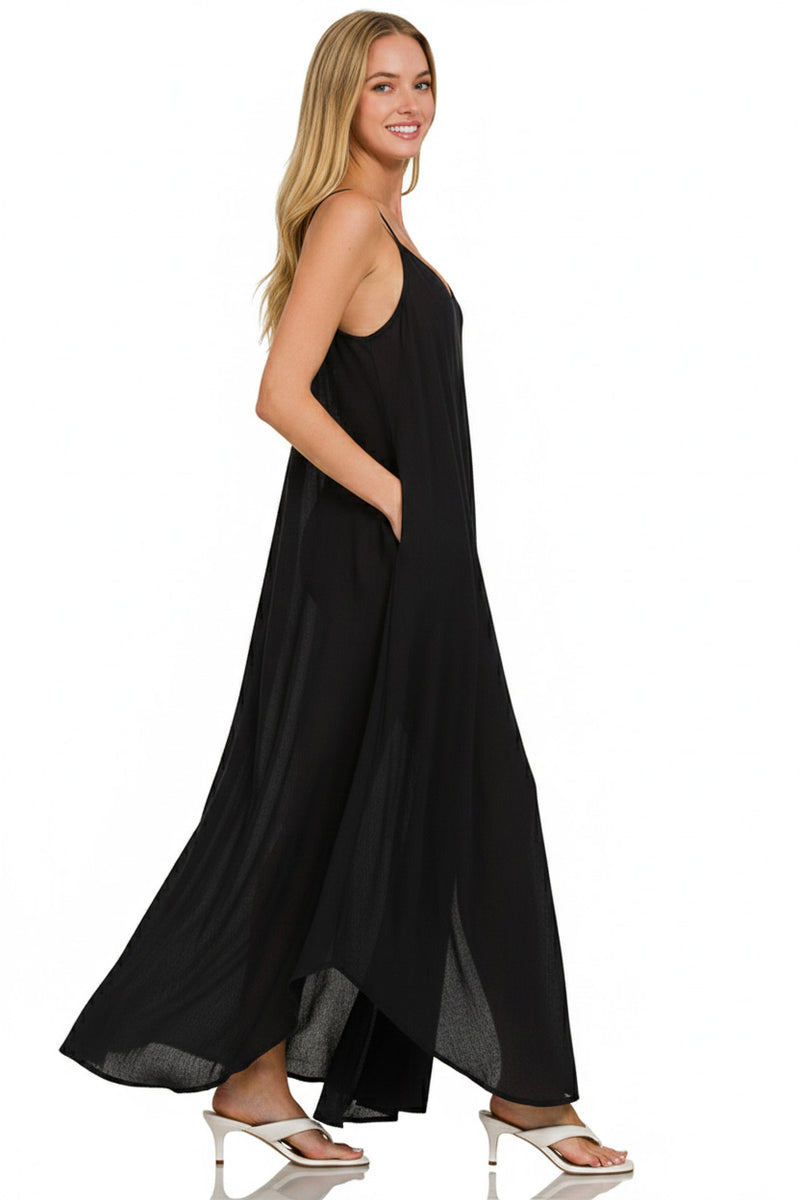 Woman wearing a black sleeveless dress on a white background
