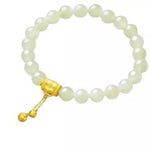 Pearl bracelet with a gold clasp on a white background