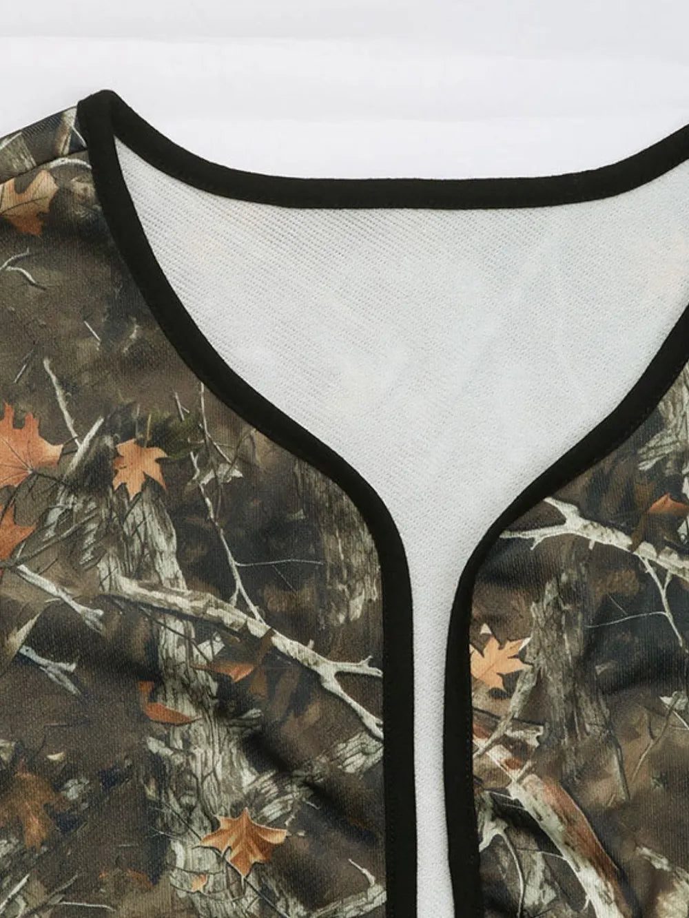 Close-up of a camouflage-patterned garment with a white interior lining.