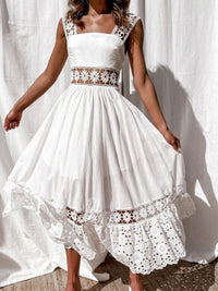 White dress with lace details on a white background