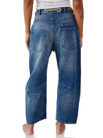 Blue jeans worn by a person on a white background