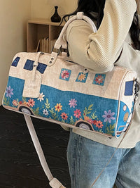 Person holding a floral and camper van design bag with a blurred background