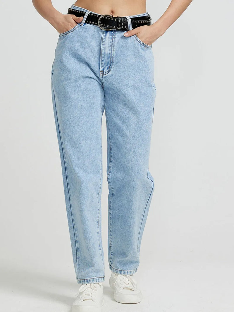 Light blue jeans worn by a person on a white background