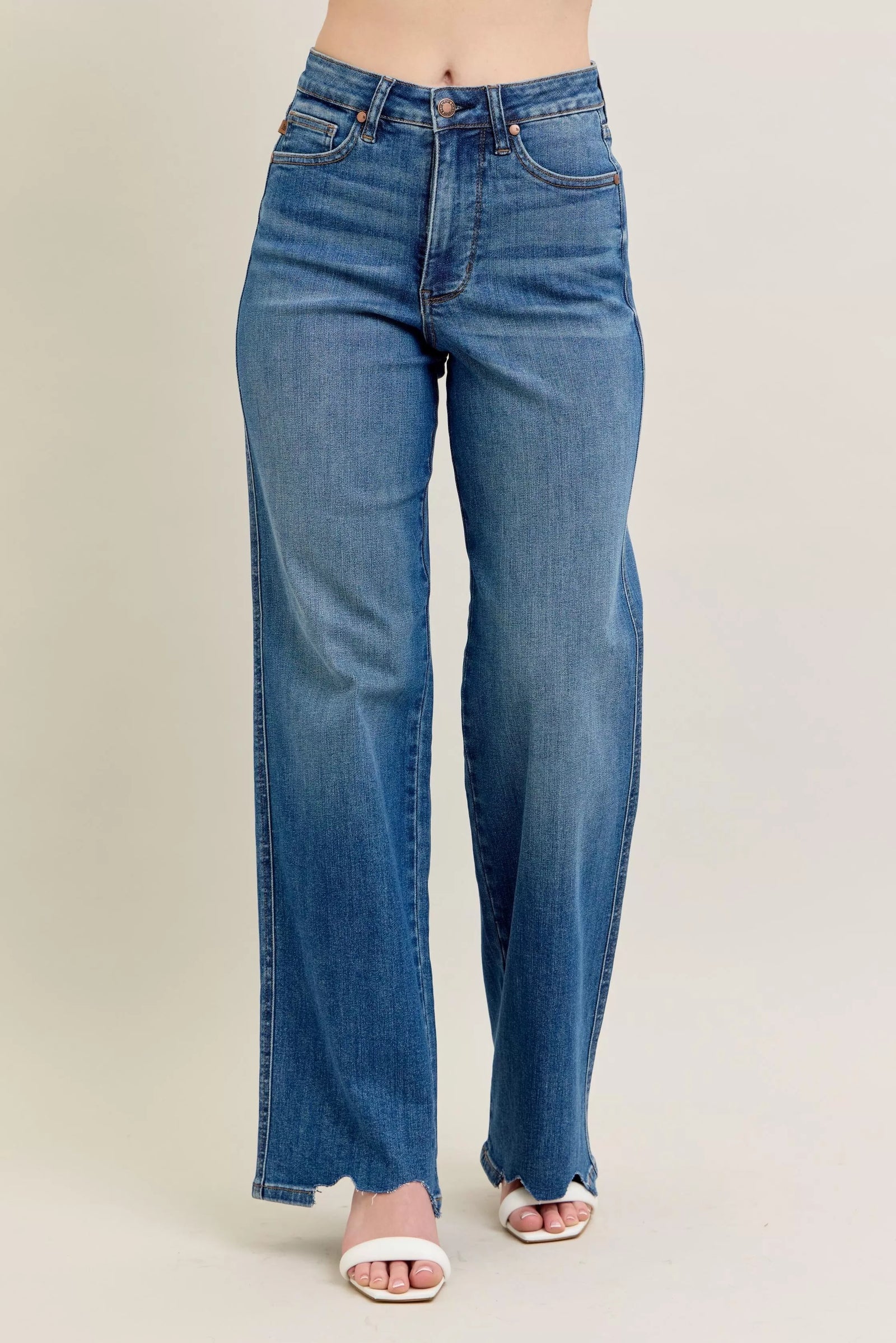 Blue jeans on a beige background