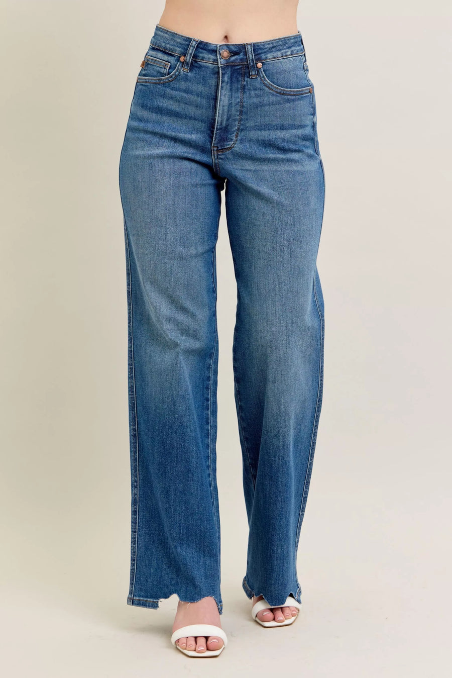 Blue jeans on a beige background