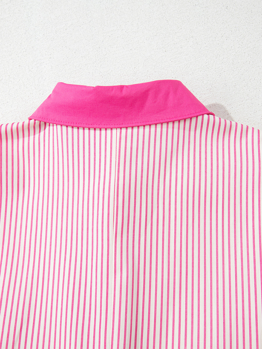 Close-up of a pink and white striped shirt with a pink collar on a light gray background